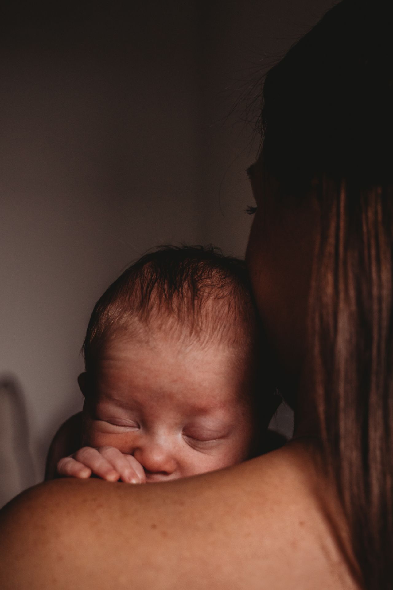Best Maternity and Newborn Photographer Washington DC Maryland Virginia newborn resting on mother's shoulder