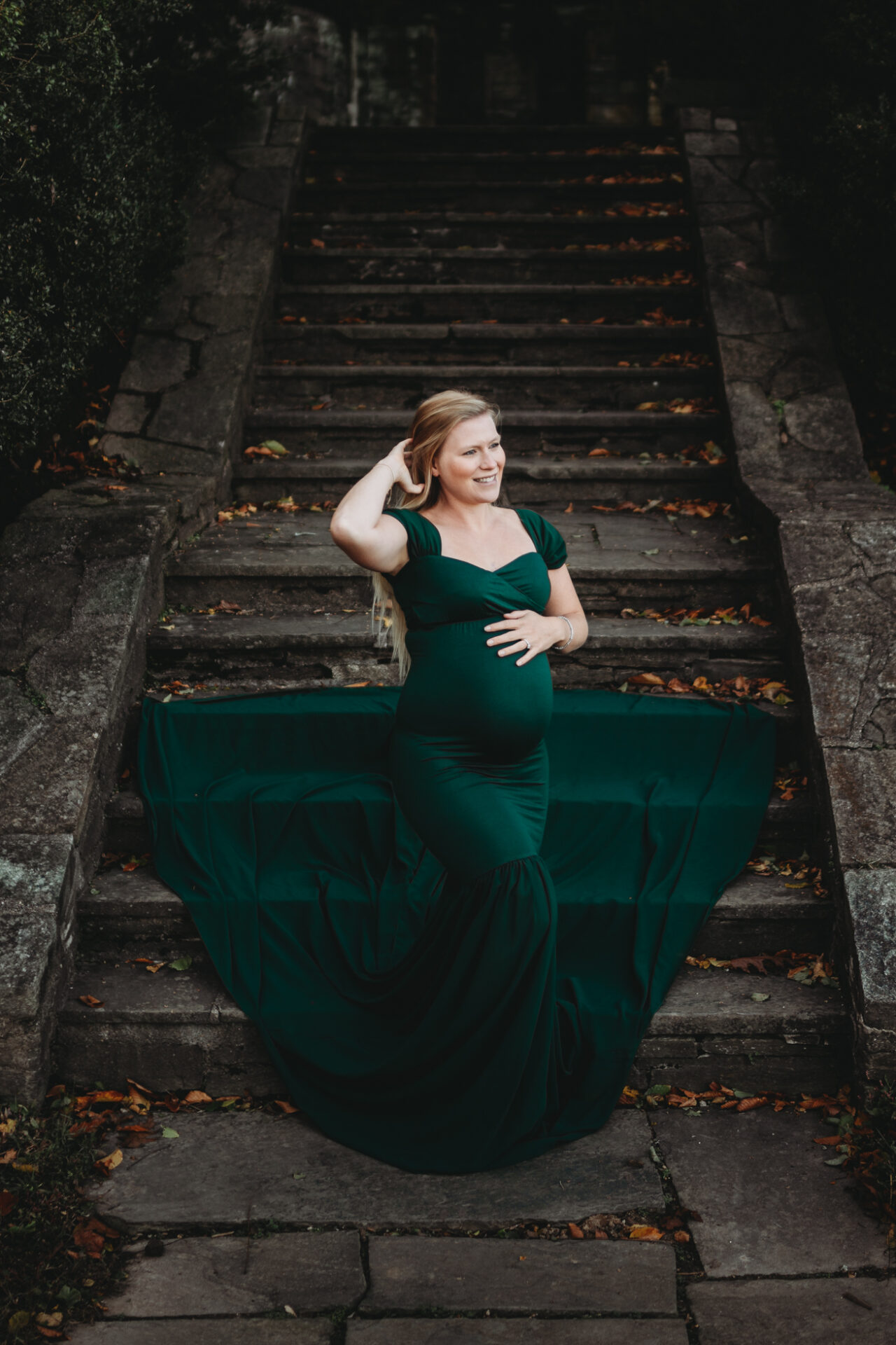 glamorous outdoor maternity photo pregnancy emerald green dress
